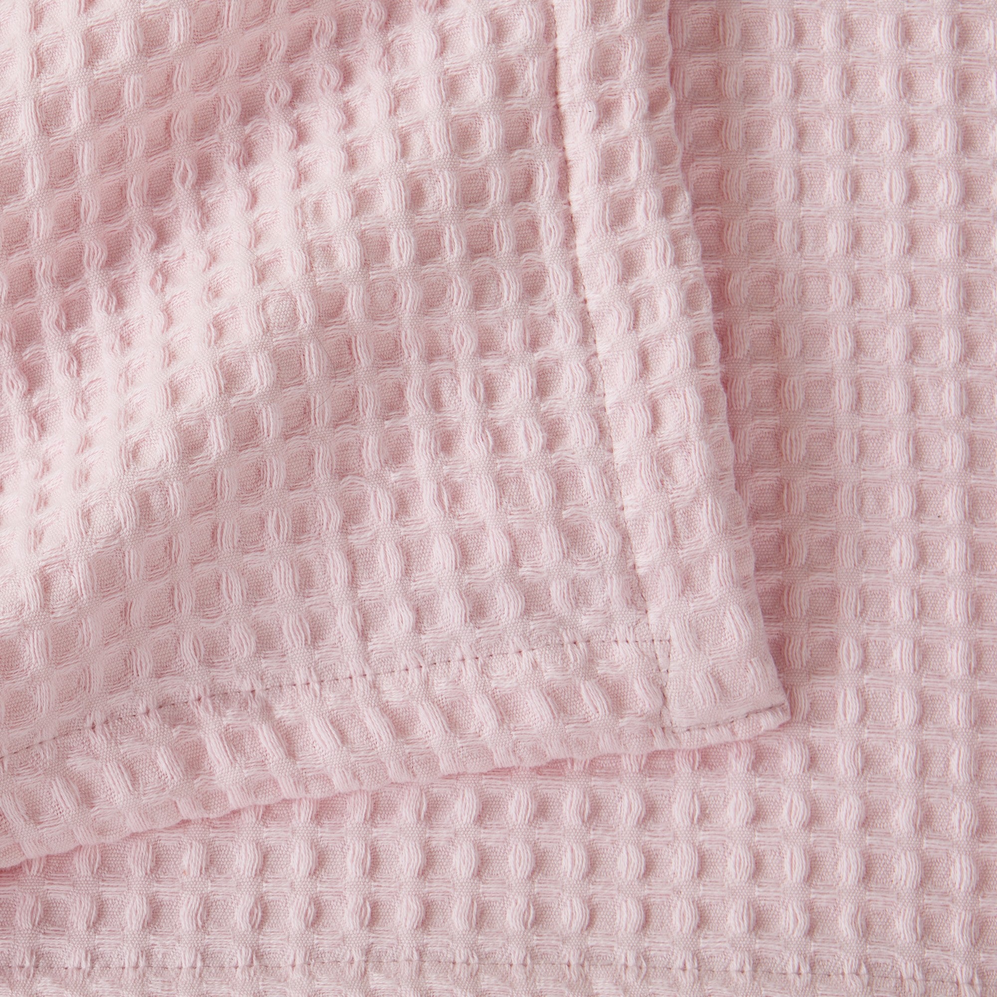 Brielle Collection Cotton Waffle Blanket by Market & Place featuring soft, breathable 100% cotton construction with a classic waffle weave texture. Available in multiple colors and shown folded, layered on beds, and in detailed fabric close-ups, highlighting its lightweight comfort and versatile year-round style.