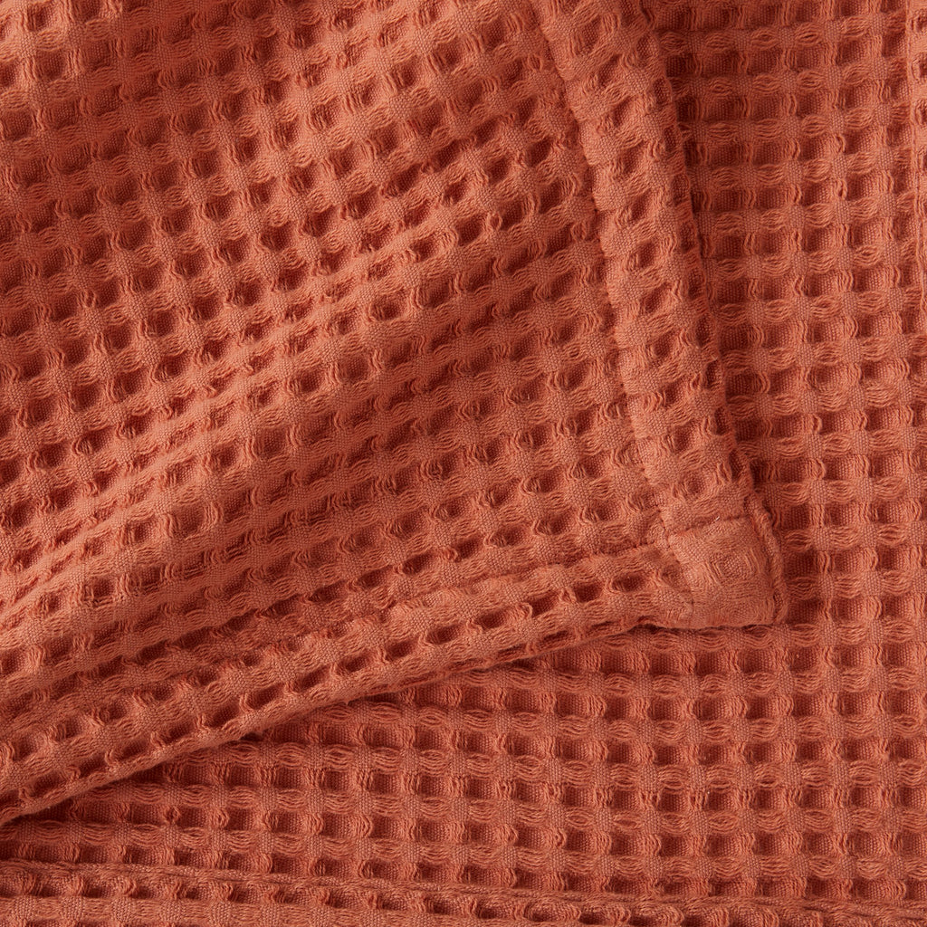 Brielle Collection Cotton Waffle Blanket by Market & Place featuring soft, breathable 100% cotton construction with a classic waffle weave texture. Available in multiple colors and shown folded, layered on beds, and in detailed fabric close-ups, highlighting its lightweight comfort and versatile year-round style.