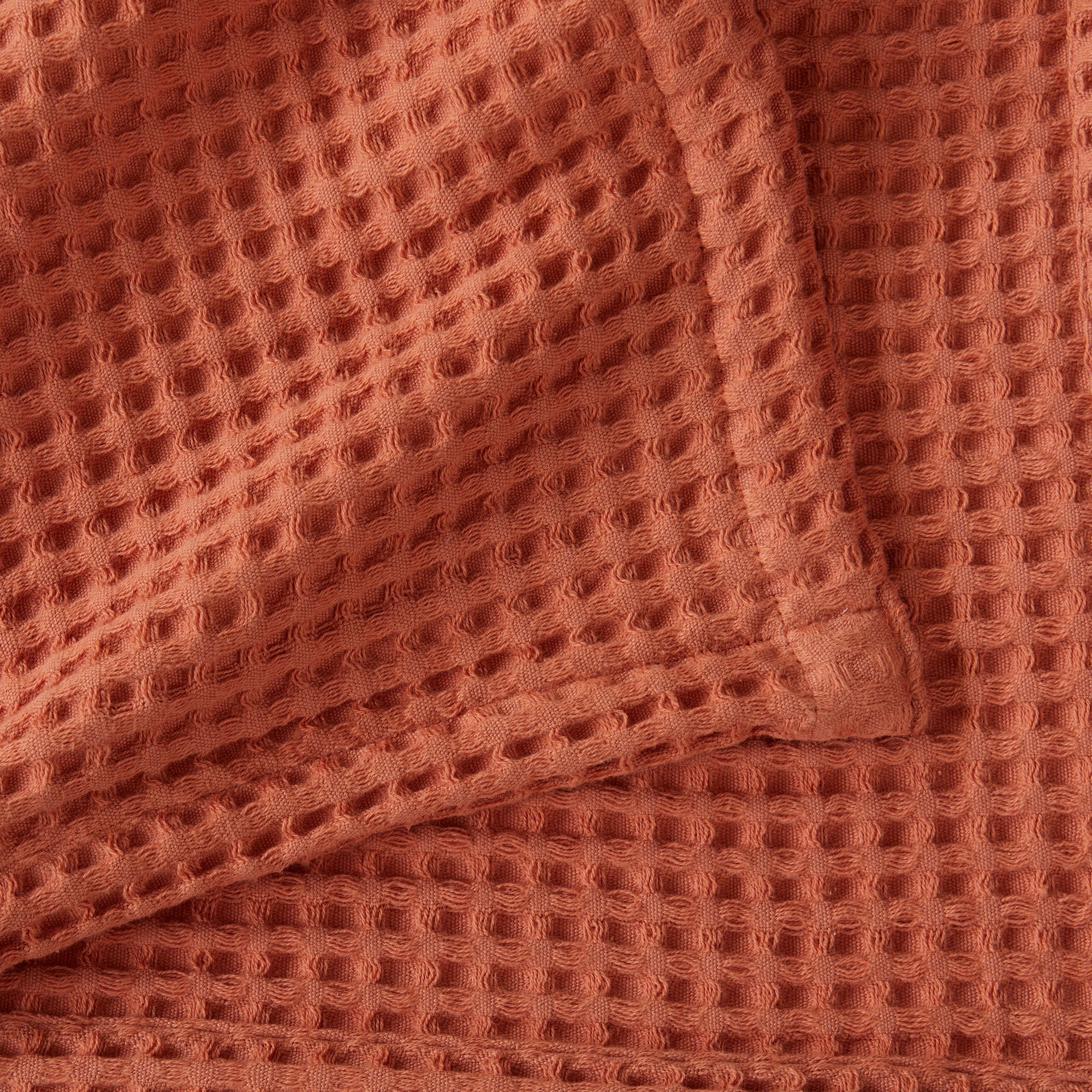 Brielle Collection Cotton Waffle Blanket by Market & Place featuring soft, breathable 100% cotton construction with a classic waffle weave texture. Available in multiple colors and shown folded, layered on beds, and in detailed fabric close-ups, highlighting its lightweight comfort and versatile year-round style.