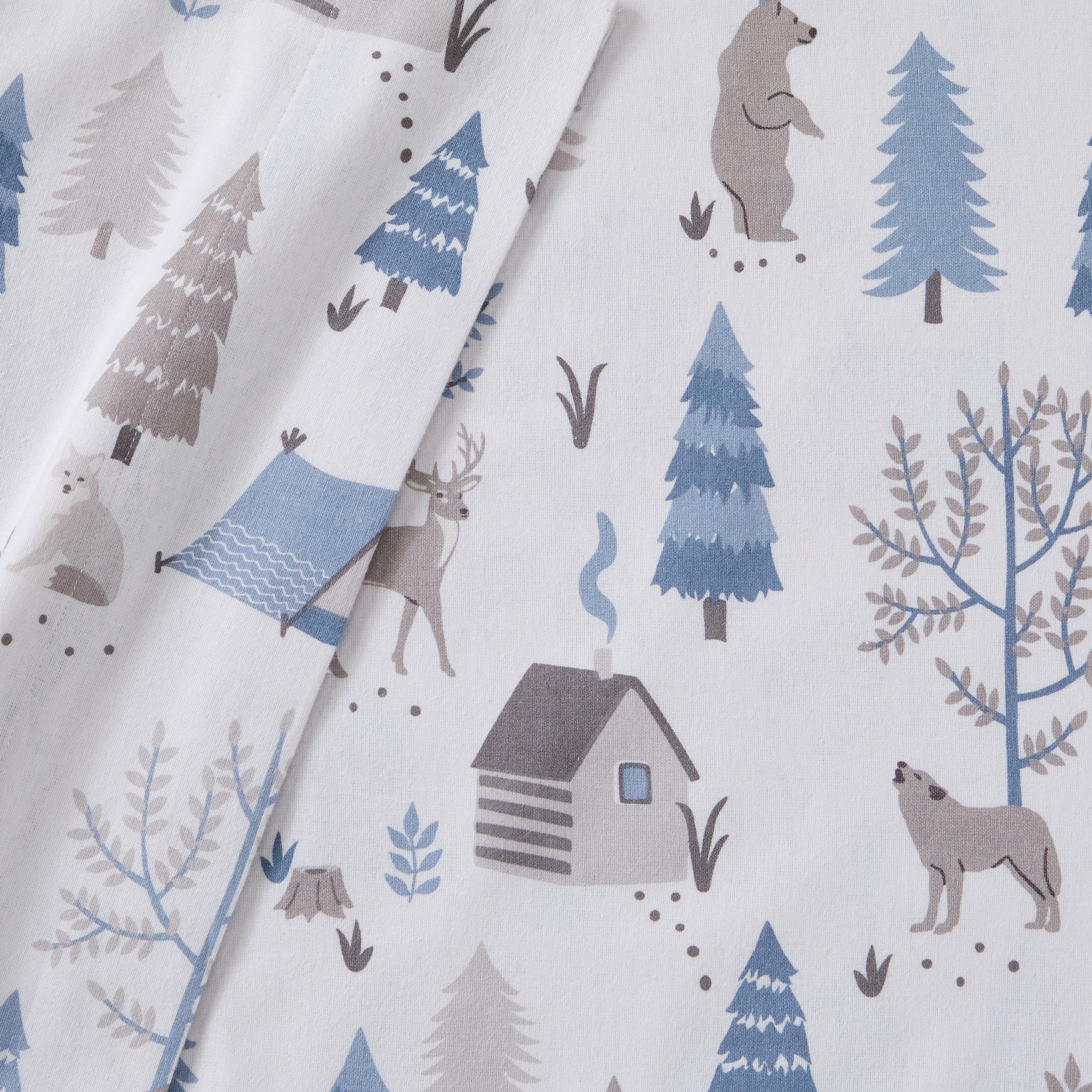 Printed 100% Turkish cotton flannel sheet set featuring assorted winter-inspired patterns, including woodland animals, snowflakes, trees, plaids, and seasonal motifs. Soft, cozy bedding shown in styled bedroom settings with close-up fabric details and folded sheet stacks in multiple designs.