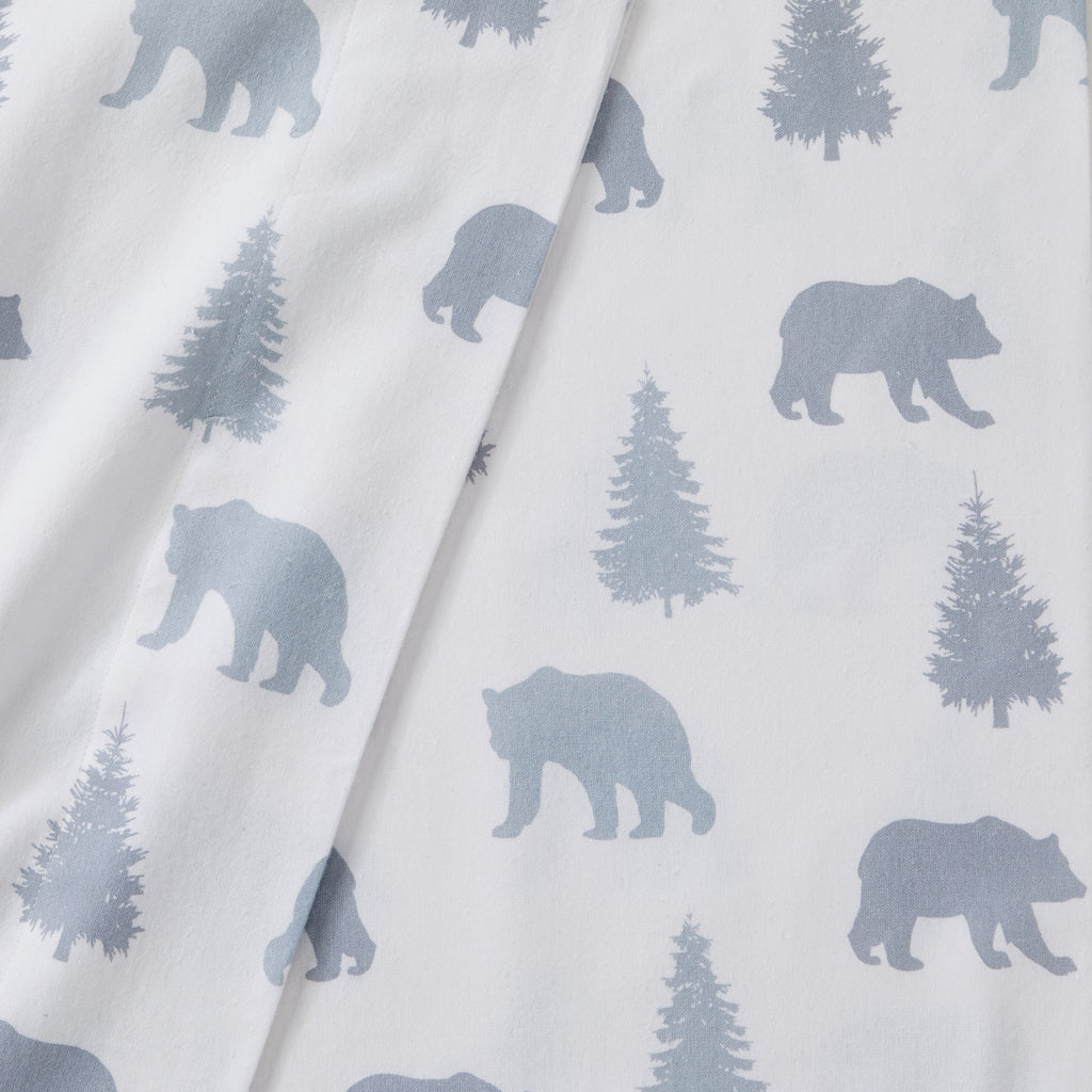 Printed 100% Turkish cotton flannel sheet set featuring assorted winter-inspired patterns, including woodland animals, snowflakes, trees, plaids, and seasonal motifs. Soft, cozy bedding shown in styled bedroom settings with close-up fabric details and folded sheet stacks in multiple designs.