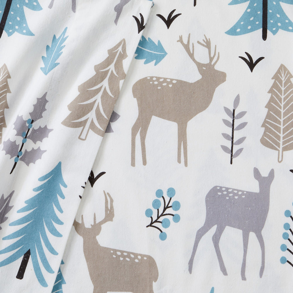 Printed 100% Turkish cotton flannel sheet set featuring assorted winter-inspired patterns, including woodland animals, snowflakes, trees, plaids, and seasonal motifs. Soft, cozy bedding shown in styled bedroom settings with close-up fabric details and folded sheet stacks in multiple designs.