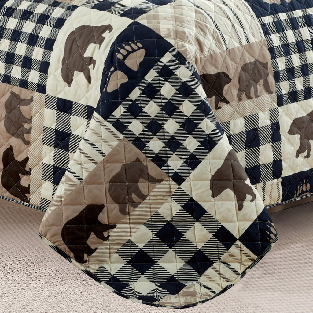 Orson Collection Lodge Quilt Set by Market & Place featuring soft microfiber construction and rustic lodge-inspired patchwork designs with plaid patterns and wildlife motifs. Coordinating shams and detailed fabric close-ups are shown in cozy bedroom settings, highlighting the reversible design and year-round comfort.