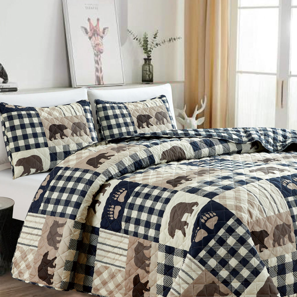 Orson Collection Lodge Quilt Set by Market & Place featuring soft microfiber construction and rustic lodge-inspired patchwork designs with plaid patterns and wildlife motifs. Coordinating shams and detailed fabric close-ups are shown in cozy bedroom settings, highlighting the reversible design and year-round comfort.