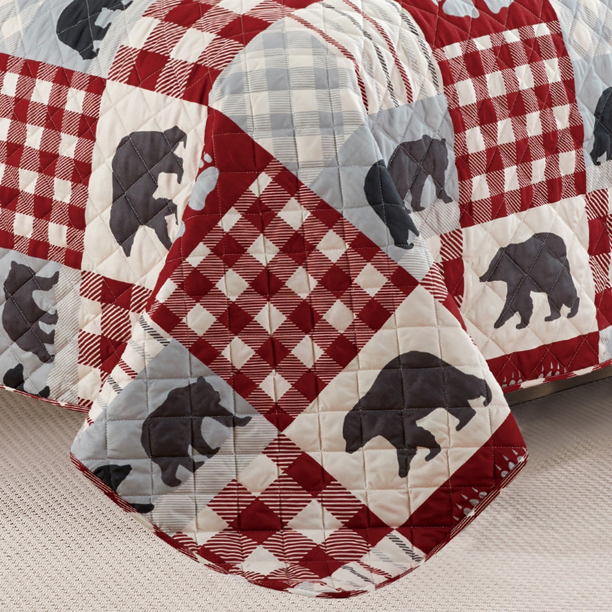 Orson Collection Lodge Quilt Set by Market & Place featuring soft microfiber construction and rustic lodge-inspired patchwork designs with plaid patterns and wildlife motifs. Coordinating shams and detailed fabric close-ups are shown in cozy bedroom settings, highlighting the reversible design and year-round comfort.