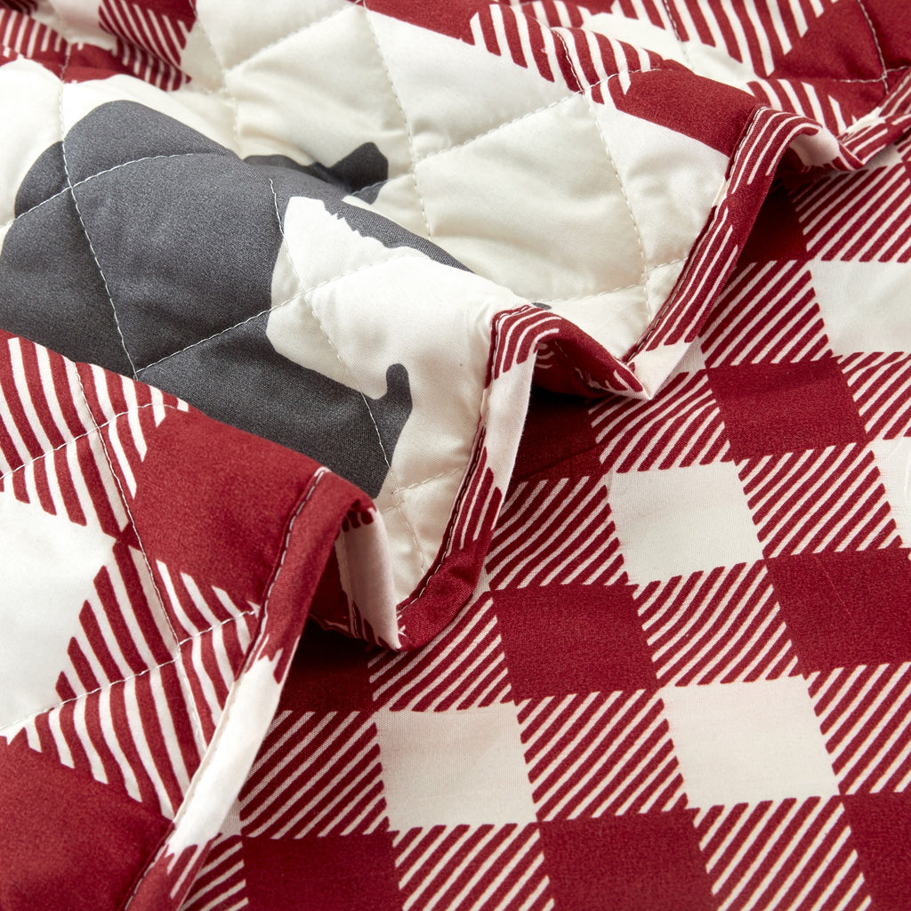 Orson Collection Lodge Quilt Set by Market & Place featuring soft microfiber construction and rustic lodge-inspired patchwork designs with plaid patterns and wildlife motifs. Coordinating shams and detailed fabric close-ups are shown in cozy bedroom settings, highlighting the reversible design and year-round comfort.