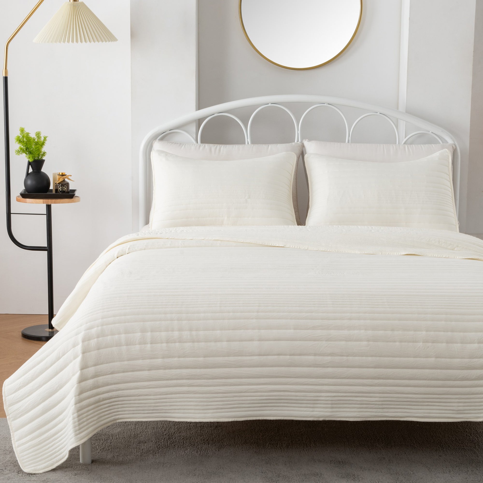 Parker Collection Solid Embroidered Quilt Set by Market & Place featuring soft microfiber construction and elegant channel embroidery. Available in multiple colors with coordinating shams and detailed fabric close-ups, styled in a modern bedroom setting.
