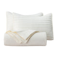 Parker Collection Solid Embroidered Quilt Set by Market & Place featuring soft microfiber construction and elegant channel embroidery. Available in multiple colors with coordinating shams and detailed fabric close-ups, styled in a modern bedroom setting.