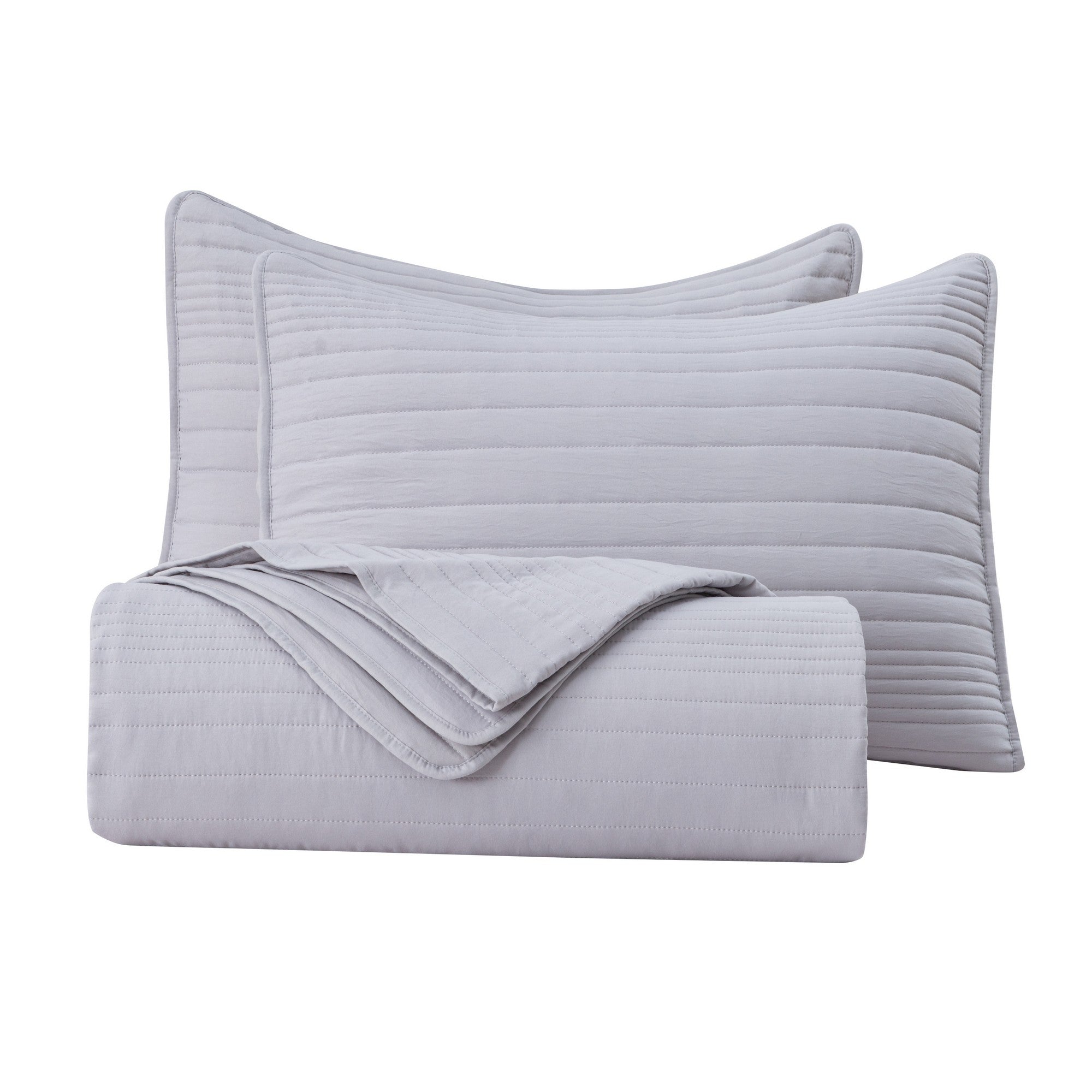 Parker Collection Solid Embroidered Quilt Set by Market & Place featuring soft microfiber construction and elegant channel embroidery. Available in multiple colors with coordinating shams and detailed fabric close-ups, styled in a modern bedroom setting.