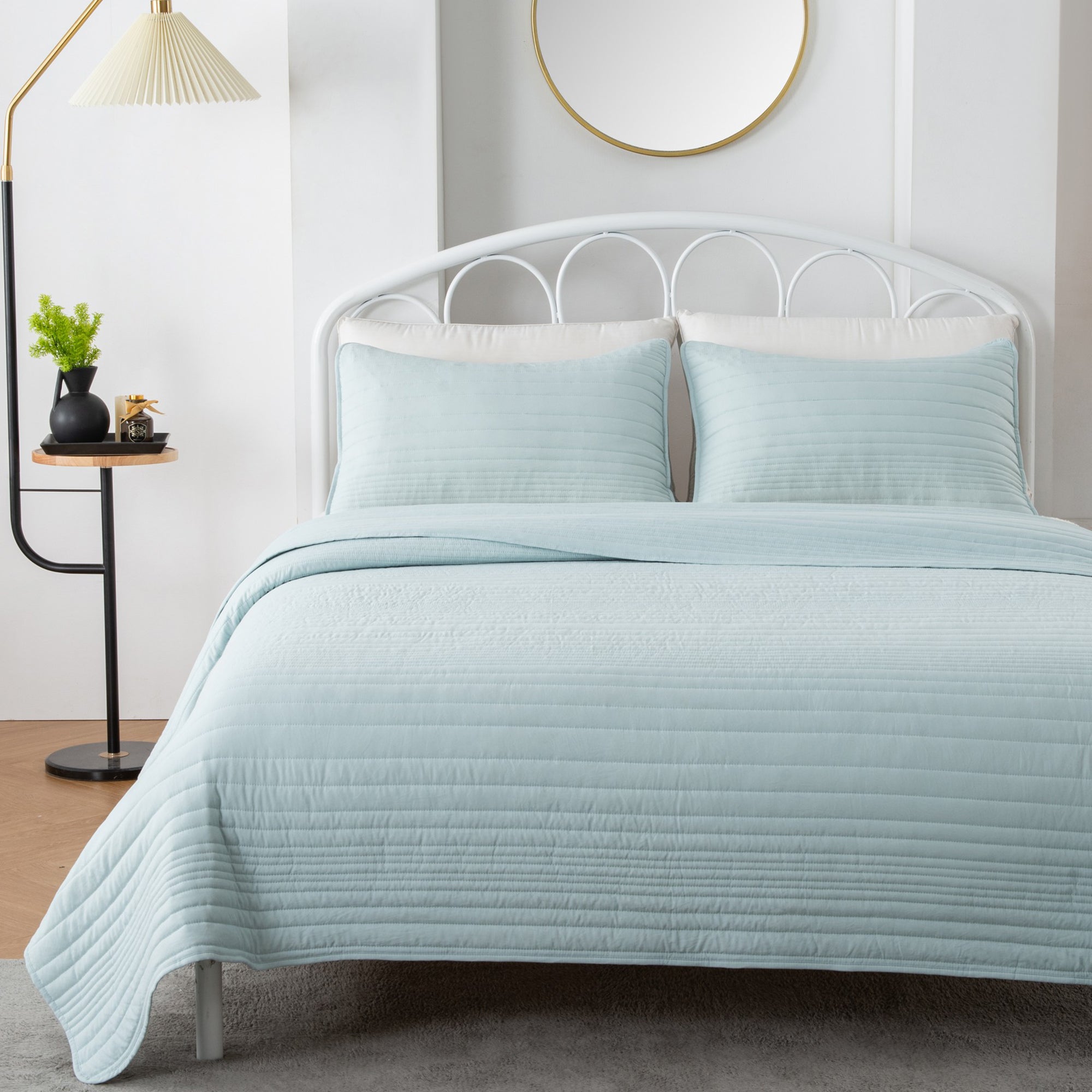 Parker Collection Solid Embroidered Quilt Set by Market & Place featuring soft microfiber construction and elegant channel embroidery. Available in multiple colors with coordinating shams and detailed fabric close-ups, styled in a modern bedroom setting.