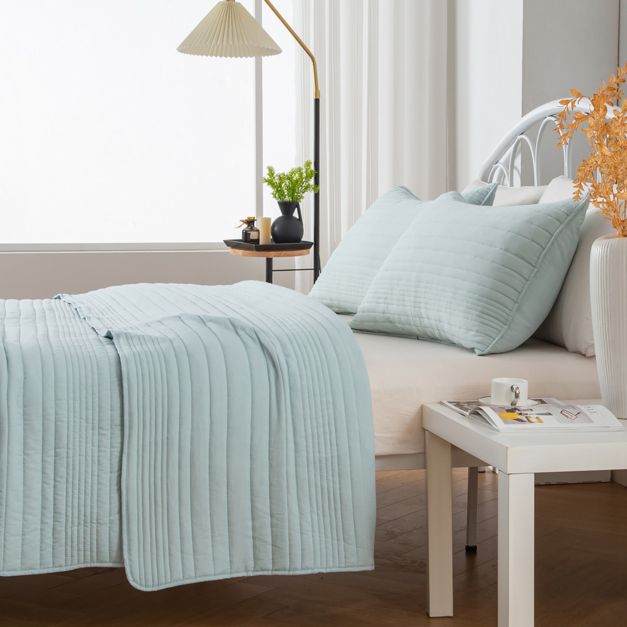 Parker Collection Solid Embroidered Quilt Set by Market & Place featuring soft microfiber construction and elegant channel embroidery. Available in multiple colors with coordinating shams and detailed fabric close-ups, styled in a modern bedroom setting.