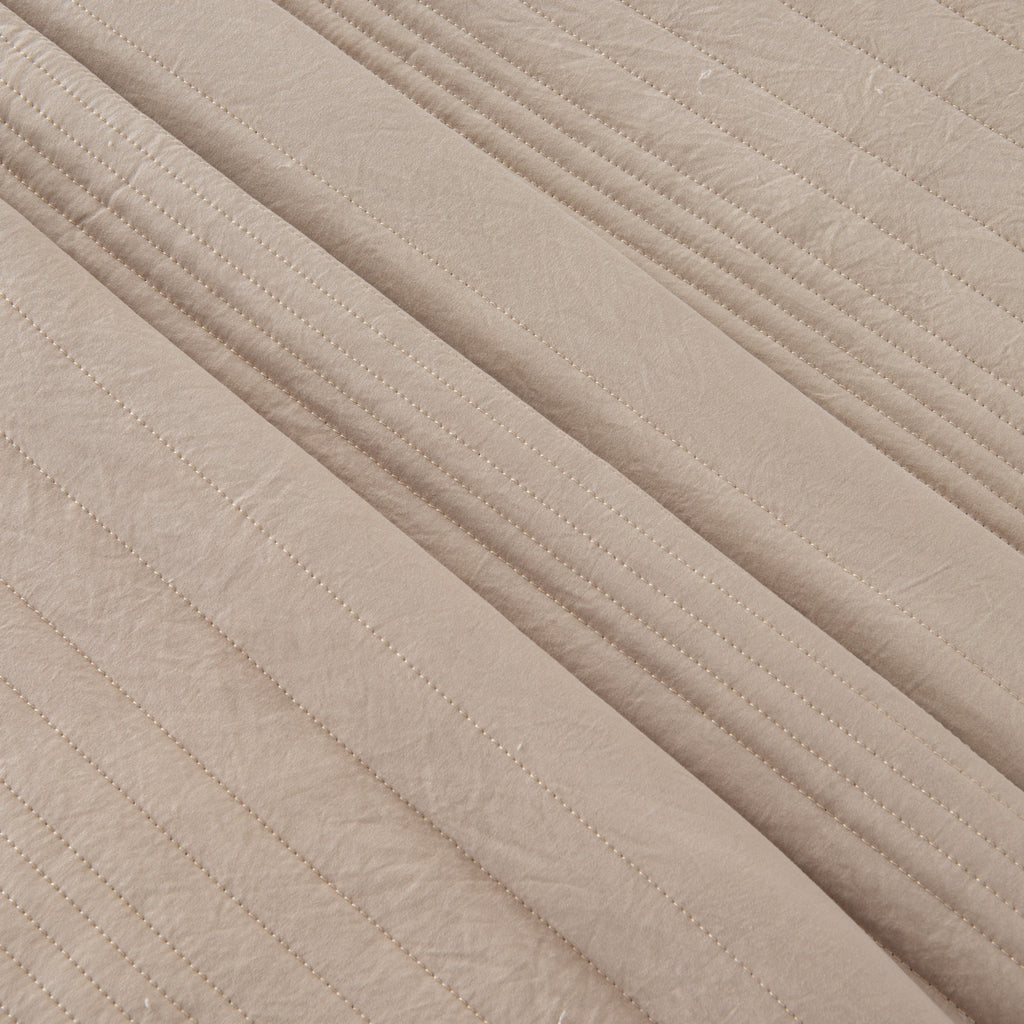 Parker Collection Solid Embroidered Quilt Set by Market & Place featuring soft microfiber construction and elegant channel embroidery. Available in multiple colors with coordinating shams and detailed fabric close-ups, styled in a modern bedroom setting.