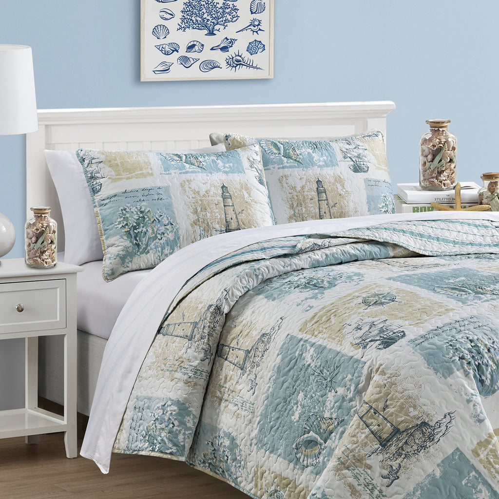 Coastal Collection Reversible Quilt Set by Market & Place featuring soft microfiber construction and coastal-inspired prints, including seashells, starfish, seahorses, coral, and ocean motifs. Coordinating shams and detailed fabric close-ups are shown in a bright bedroom setting, highlighting the reversible design and all-season comfort.