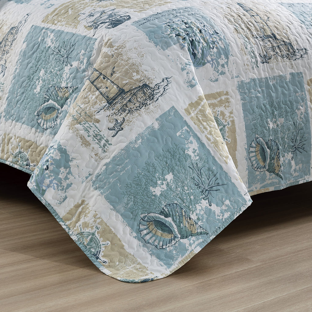 Coastal Collection Reversible Quilt Set by Market & Place featuring soft microfiber construction and coastal-inspired prints, including seashells, starfish, seahorses, coral, and ocean motifs. Coordinating shams and detailed fabric close-ups are shown in a bright bedroom setting, highlighting the reversible design and all-season comfort.